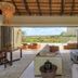 Four Seasons Safari Lodge Serengeti living room opening to Serengeti view and outdoor seating