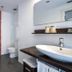 Hotel Spa La Central - Adults Only bathroom with bathtub, walk-in shower, sink, and toilet in Maçanet de Cabrenys