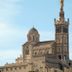 ibis budget Marseille Est Porte d'Aubagne near Marseille with Basilica-style church and statue skyline