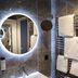 Achat Hotel Monschau bathroom with illuminated round mirror, sink and towel rack in Monschau