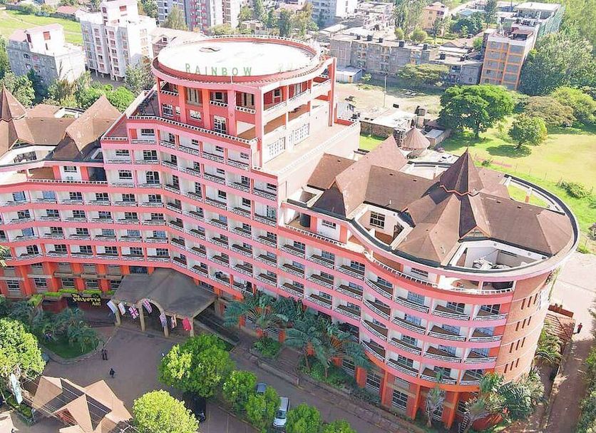 Rainbow Ruiru Resort in Nairobi, aerial view of the pink hotel building with curved wings and rooftop terrace