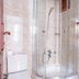 Atelya Art Hotel Antalya bathroom with glass shower, toilet, sink and wall mirror