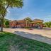 Quality Inn West Plano - Dallas exterior in Plano with brick entrance, driveway and landscaped grounds