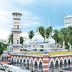 Sindbad Hotel Kuala Lumpur exterior with ornate minaret-like tower, domed building and palm trees
