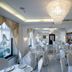 La Panoramica Hotel in Castellammare di Stabia dining room with set tables and crystal chandeliers