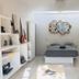 Radio Tulum guest room with bed, built-in shelving, sofa, and wall art in Tulum