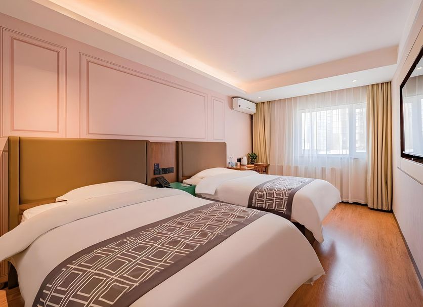Greentree Inn Beijing Guangmingqiao Hotel in Beijing twin guest room with window and wall-mounted TV