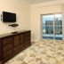 Crystal Towers Gulf Shores bedroom with balcony, ocean view and TV