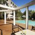 Garden Court Eastgate in Johannesburg with outdoor pool, patio seating and sun umbrellas