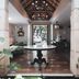 Hotel Tibera Taman Cibeunying Bandung lobby with round table, high wood ceiling and outdoor view