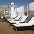 Hospes Las Casas del Rey de Baeza in Seville rooftop terrace with sun loungers and white cabanas