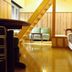 Cafe & Inn That Sounds Good in Semboku room with wooden staircase, bed and seating area