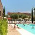 hu Firenze Camping in Town in Florence: outdoor pool with loungers and swimmers under a sunny sky