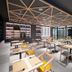 Travelodge Phuket Town dining area in Phuket City with geometric ceiling, tables, and wall display shelves