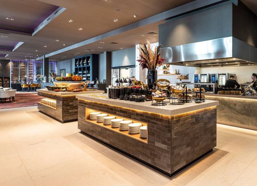 Van der Valk Hotel Sneek in Sneek buffet restaurant with island food stations and open kitchen