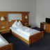 Erbgericht Gaststätte & Pension guest room in Brand-Erbisdorf with twin beds and a TV desk