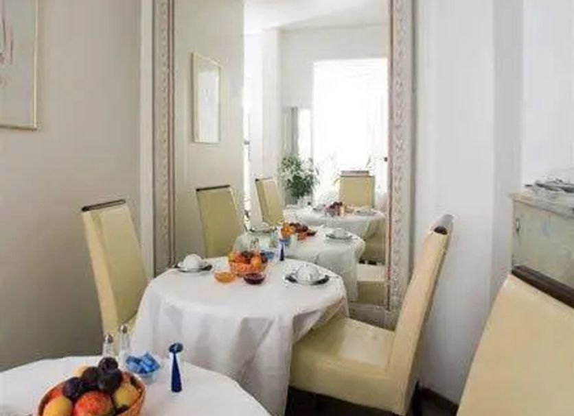 Dining nook at Hotel Goldener Hecht in Heidelberg with table setting and large mirror