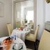 Dining nook at Hotel Goldener Hecht in Heidelberg with table setting and large mirror