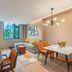 Home2 Suites by Hilton Xishuangbanna Jinghong suite with living area, dining table and jungle-view window