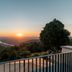 Sunset view over Heidelberg from Berggasthof Königstuhl terrace with distant hills and river
