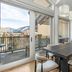 Antlers at Vail dining area with balcony, mountain views, and glass doors overlooking Vail