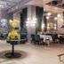 City Park Hotel Chisinau stylish hotel lounge with dining tables, teal curtains and floral centerpiece