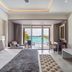 Grand Lido Negril Au-Naturel room with ocean view, balcony seating, and king bed in Negril