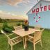 Best Motel Bowling Green outdoor seating on lawn beside motel building