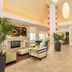 Hilton Garden Inn Roseville lobby with fireplace, seating area and tall pendant lights