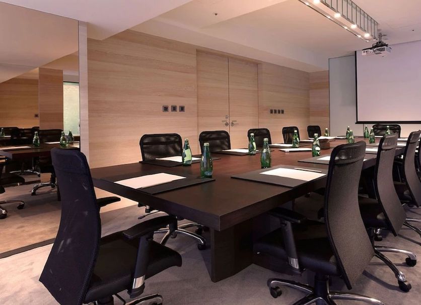 Hotel Cozzi Minsheng Taipei meeting room with long conference table and black office chairs in Taipei City