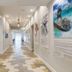 Guy Harvey Resort on Saint Augustine Beach hallway with beach-themed art and patterned flooring