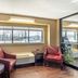Red Roof Inn Danville, PA lobby seating area with chairs, table, and large window view
