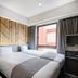 DEL style Fukuoka Nishinakasu by Daiwa Roynet Hotel room with twin bed and city-view window in Fukuoka