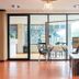 Sk Boutique Mahanakhon Bangkok lounge with glass doors, seating area, and city view