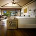 Four Seasons Resort Lanai room with ocean view, balcony doors, and a king bed in Lanai City