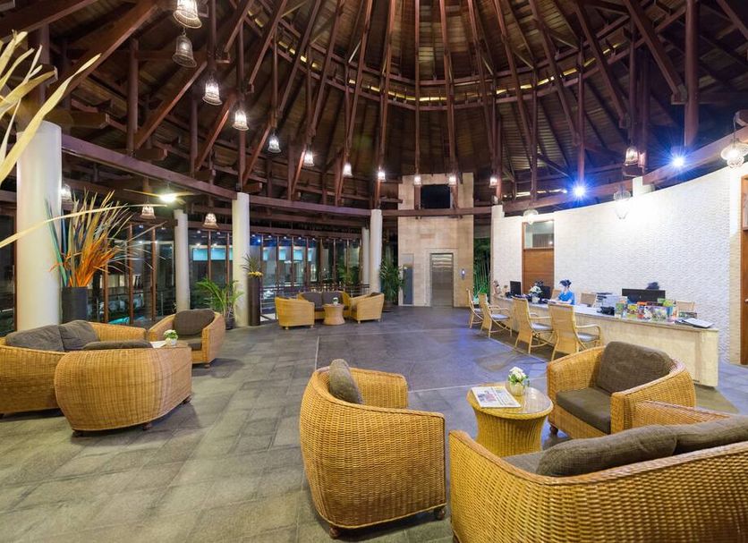 The Haven Khao Lak in Khao Lak lobby lounge with wicker seating under a high domed roof