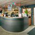Loft - Hi Eco Hostel Reykjavik reception desk with colorful bunting and bar seating