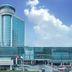 Shengshi Civil Aviation Hotel in Zhengzhou with a tall glass tower and modern entrance