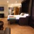 Hôtel Énergie Shawinigan guest room with two beds, TV, fireplace and kitchenette in Shawinigan