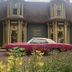 Belle View Manor Inn in Harbour Grace, historic manor exterior with vintage car in front