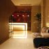 Century Star Urumqi Changjiang Road Hotel lobby with glossy marble floor and floral seating in Ürümqi