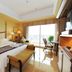 Forum For Asia Gold Coast Hotel room in Qionghai with king bed, balcony view and seating area