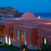 Domes of Elounda, Autograph Collection in Elounda with sea view and illuminated terrace at dusk