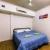 Global Backpackers Cairns Central room with double bed, air conditioning and frosted glass door in Cairns