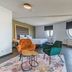 Leonardo Hotel Ijmuiden Seaport Beach room with twin beds, seating area and round windows in IJmuiden