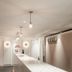 Caritas Oswald Cheung International House lobby corridor with long counter and pendant lights in Hong Kong