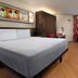 Disney's All-Star Movies Resort room in Bay Lake with king bed, dresser, wardrobe and window view