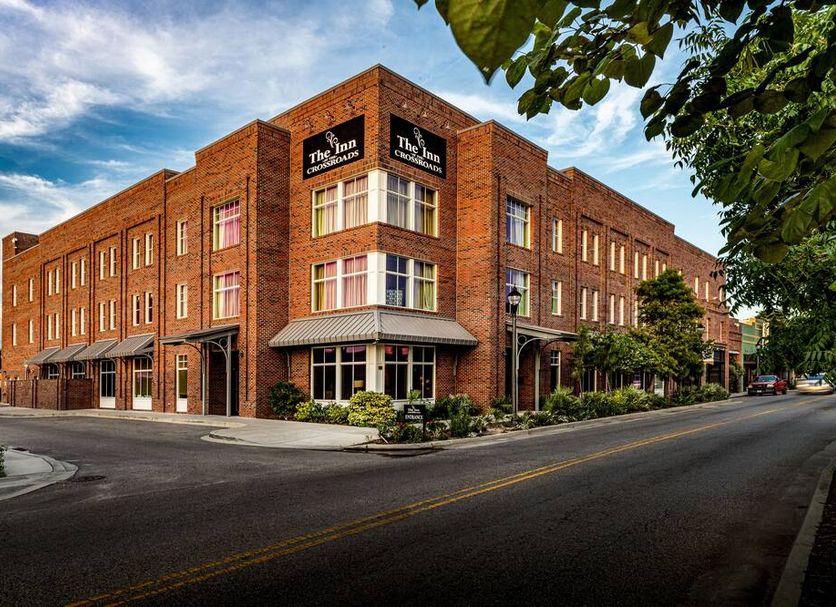 The Inn At The Crossroads in Lake City, brick hotel exterior on a street corner
