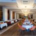 Seher Sun Palace Resort & Spa in Side dining room with set tables and chandelier lighting