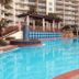 Shores of Panama Resort in Panama City Beach with a lagoon-style pool and palm trees